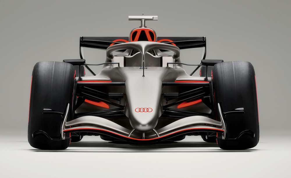 Mit seiner minimalistischen, aber kraftvollen Farbgebung aus Titanium-Grau, Carbon-Schwarz und dem neuen Audi-Rot zeigt der Bolide die neue Designphilosophie: klar, technisch, emotional